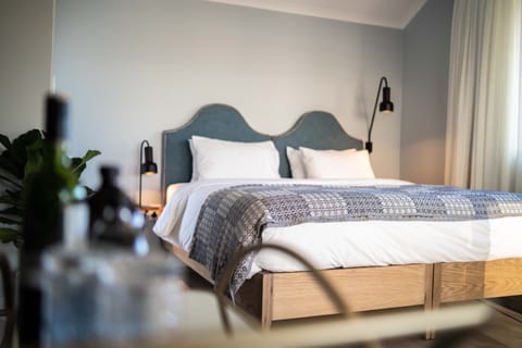 Premium Studio Suite | Premium bedding, desk, laptop workspace, blackout drapes