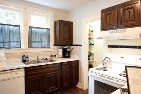 Full size kitchen. Pots, pans, dishes, glasses, mugs and silverware are provided