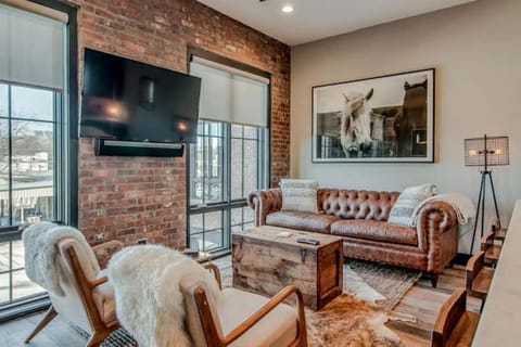 Open Living Room with SmartHDTV and ultra high end furniture