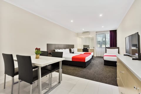 Deluxe Family Room | Desk, laptop workspace, blackout drapes, soundproofing