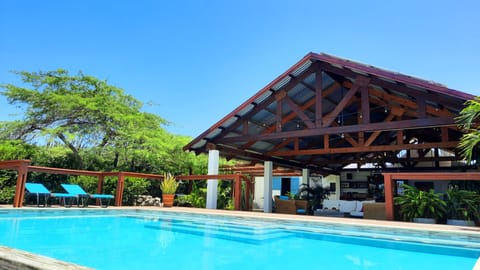 Front view of outdoor living area and kitchen 