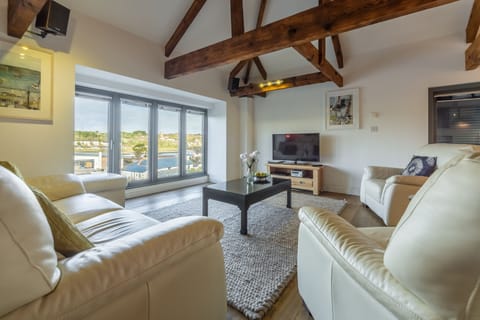 Copperhouse View, Hayle. First floor:  Sitting area with floor to ceiling windows