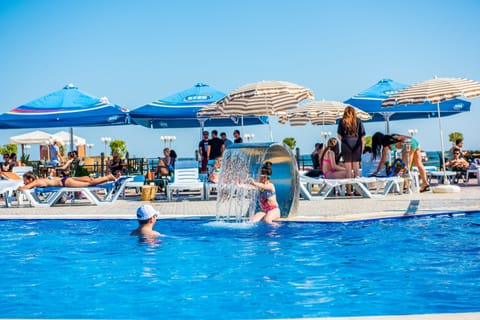 Outdoor pool, pool umbrellas, sun loungers