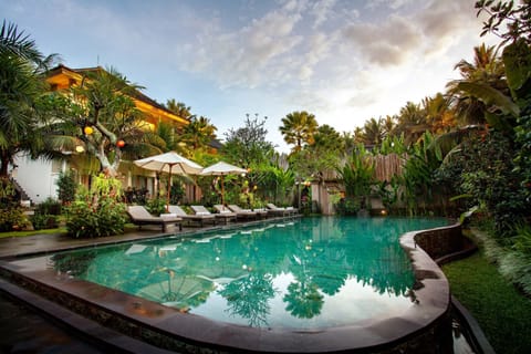Outdoor pool, open 7:00 AM to 7:00 PM, pool umbrellas, sun loungers