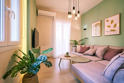 Exclusive Apartment, 4 Bedrooms | Living room | 40-inch flat-screen TV with cable channels, TV