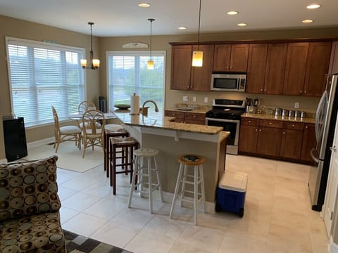 Open plan kitchen w/ seperate adult-beverage fridge on left side of photo :-).