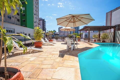 Outdoor pool, open 6:00 AM to 10:00 PM, pool umbrellas, sun loungers