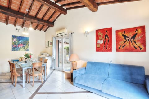 Apartment, 2 Bedrooms (VILLETTA NASSI) | Living area | Flat-screen TV