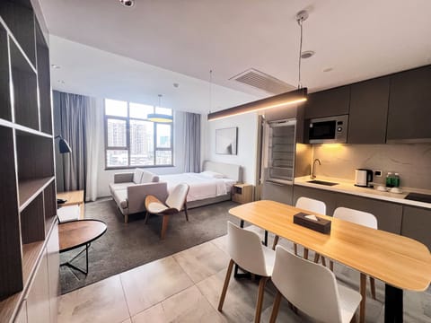 Deluxe Suite (City View) | Down comforters, pillowtop beds, desk, blackout drapes
