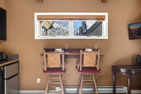 Enjoy the versatile high-top seating for two—great for dining, working, or keeping things organized.