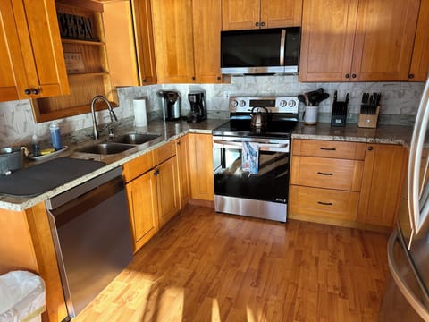 Gourmet kitchen with granite countertops and stainless steel appliances.