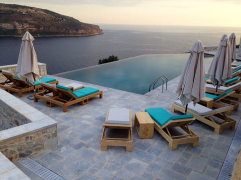 Outdoor pool, open 10:00 AM to 8:00 PM, pool umbrellas, sun loungers