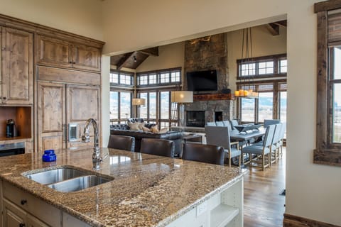 Your gourmet kitchen opens seamlessly to a cozy living space where you can cook, dine, and relax all in one beautiful flow. Granite counters, rustic wood beams, and mountain views create the perfect backdrop for your getaway.