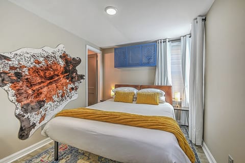 Queen Sized bed with outlets and usb plugs built into the lamps.