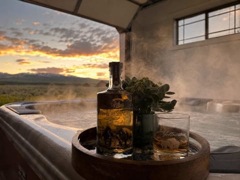 Relax and unwind in the luxury hot tub while taking in the stunning sunset views. The perfect way to end your day.
