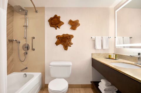 Shower, designer toiletries, hair dryer, towels