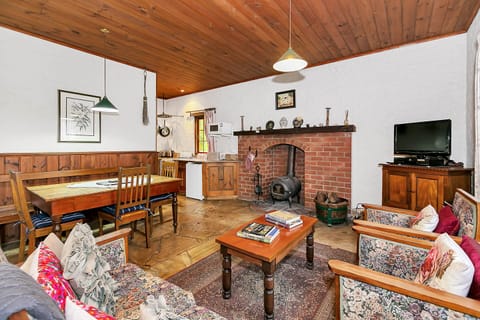 Cottage, 2 Bedrooms (Hobbit) | Living area | 50-inch flat-screen TV with digital channels, LCD TV, fireplace