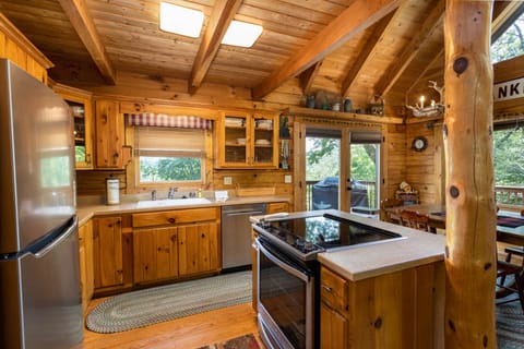 Open Kitchen has Stainless Fridge and Dishwasher