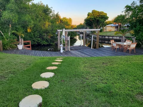 Backyard with boat lift set up for kayak launching