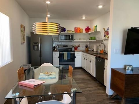 Kitchen area with dining table.