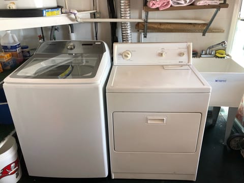 New washer and dryer located in garage