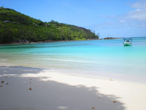 Beach nearby, white sand, beach towels