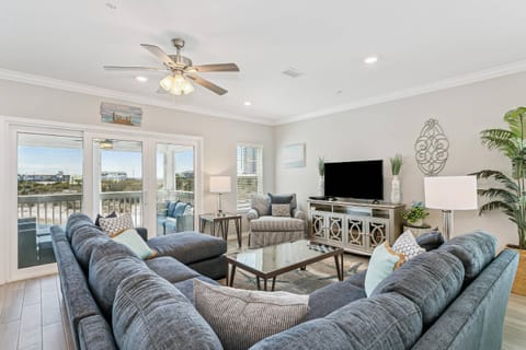Bright living area with comfortable furniture to relax in after a day at the beach