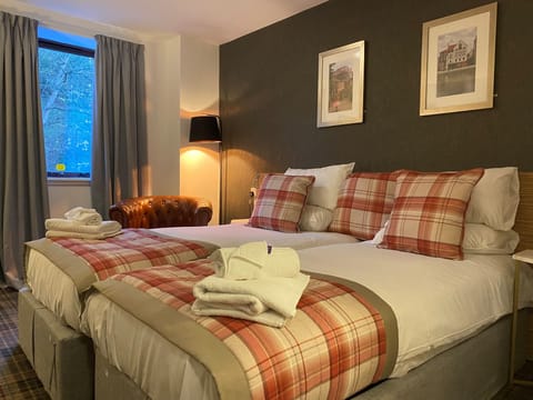 Double or Twin Executive Room | Desk, iron/ironing board, WiFi, bed sheets
