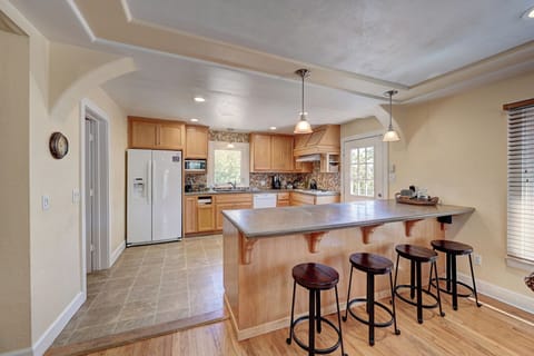 Kitchen with island and bar seating
