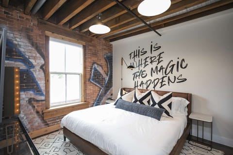 Original Graffiti with Exposed Beams and Hardware