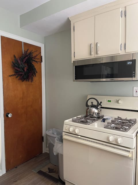 Door to basement where the full size washer and dryer are.