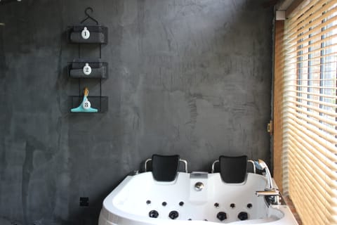 Honeymoon Loft | Bathroom | Free toiletries, hair dryer, towels