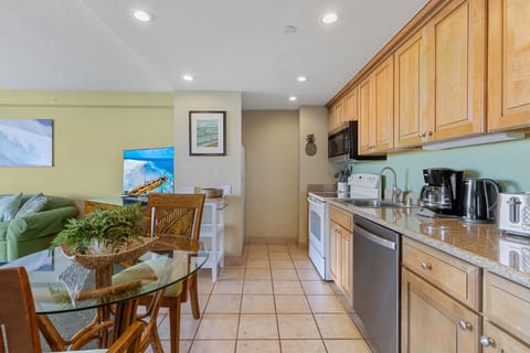 Kitchen equipped with drip coffee machine, electric kettle and toaster
