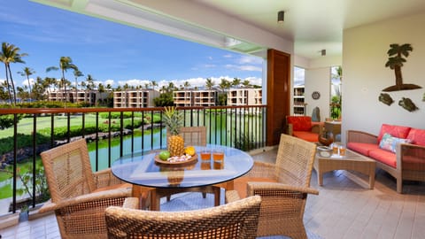 Welcome to paradise! This bright lanai offers an ideal spot for a cup of coffee.
