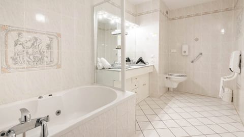 Family Room, Jetted Tub | Bathroom | Free toiletries, hair dryer, towels