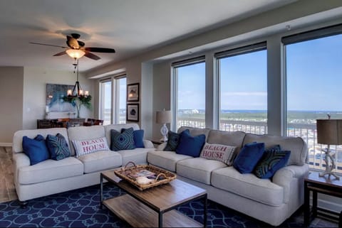 Relax in your bright living space with stunning ocean views and coastal-themed decor that perfectly frames your beach getaway.