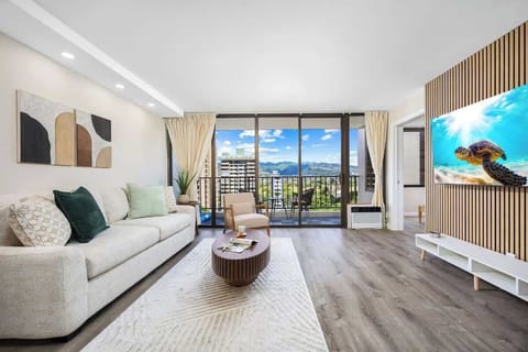 Relax in your living area with a pull-out sleeper sofa and a 65" smart TV for your entertainment