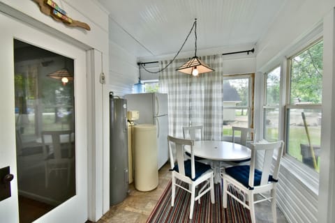 Morning porch with extra refrigerator.