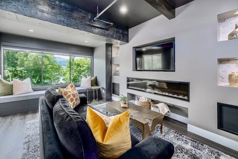 Living room with stunning views of lake and park