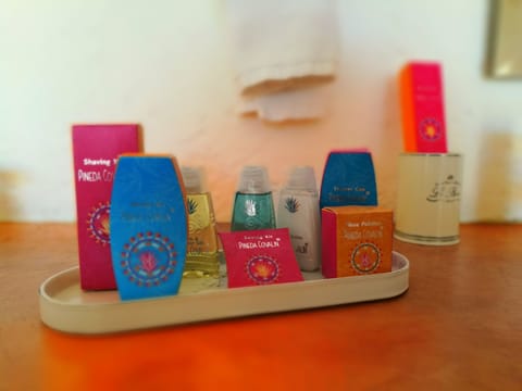 Shower, designer toiletries, hair dryer, towels