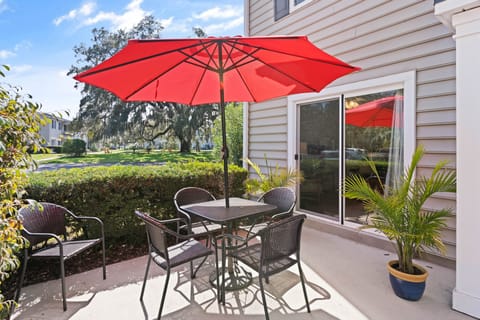 Bright and sunny patio close to pools and lake. 