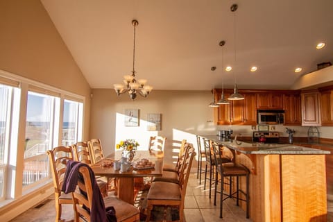 The open floorplan is perfect for spending time together over dinner after a day of coastal adventures.
