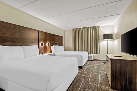 Suite, 2 Queen Beds | Laptop workspace, blackout drapes, iron/ironing board, cribs/infant beds