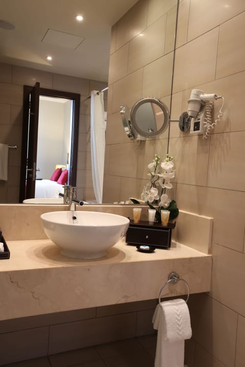 Eco-friendly toiletries, hair dryer, bathrobes, slippers