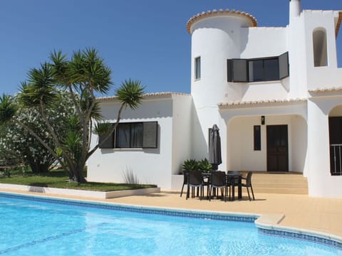 Water, Building, Sky, Plant, Window, Azure, Swimming Pool, Tree, Shade, Outdoor Furniture