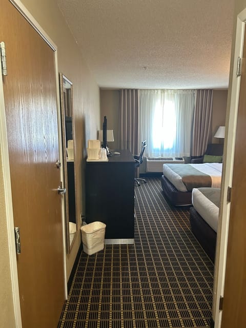 Desk, blackout drapes, iron/ironing board, free cribs/infant beds