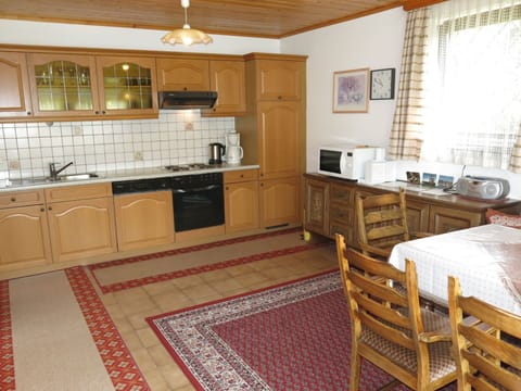 Cabinetry, Countertop, Property, Kitchen Sink, Furniture, Sink, Kitchen Stove, Wood, Lighting, Kitchen Appliance