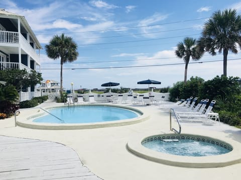 View of the pool and hot tub towards the Gulf.