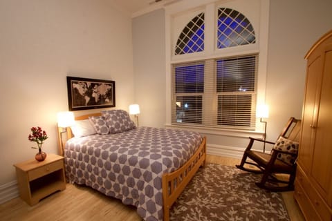 Bedroom with a queen-sized bed. (1)