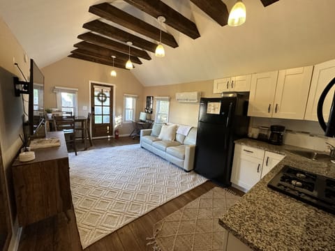 Get comfy in the cottage living room with exposed beams